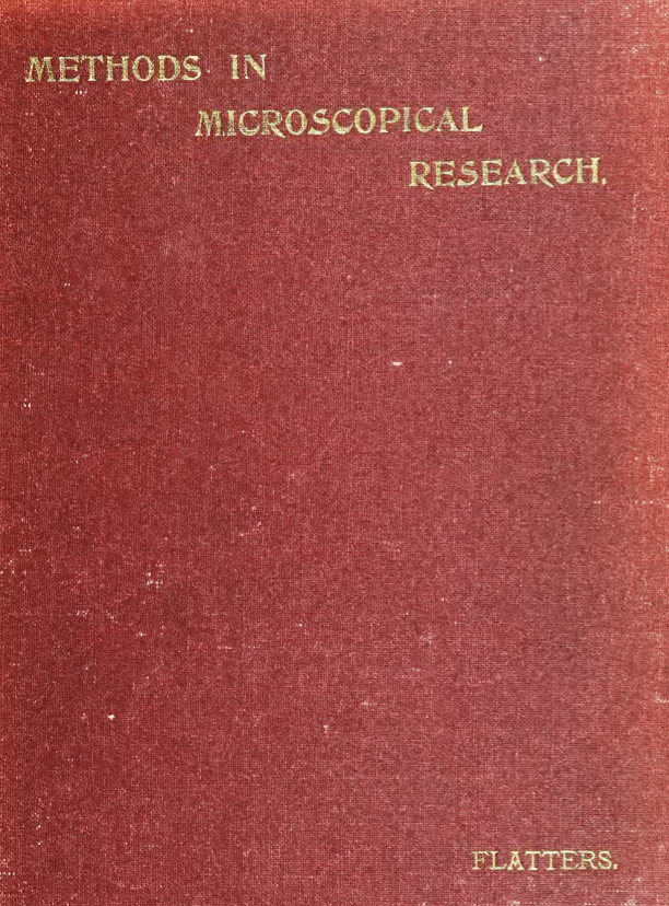 A red book with gold text
Description automatically generated