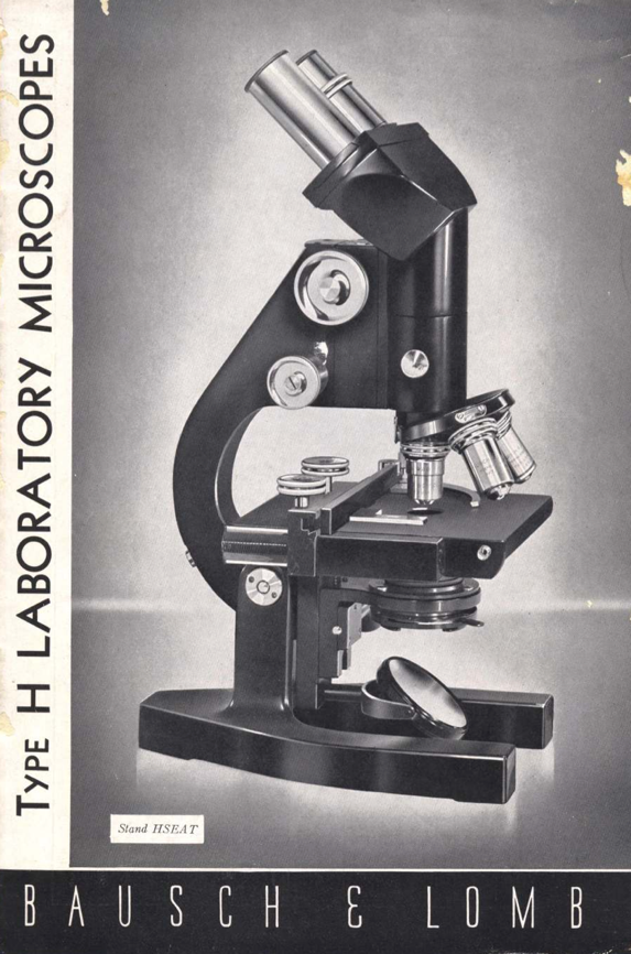 A black microscope with silver lenses
Description automatically generated