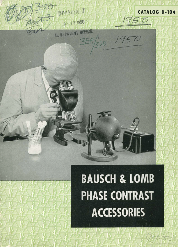 A person looking through a microscope
Description automatically generated