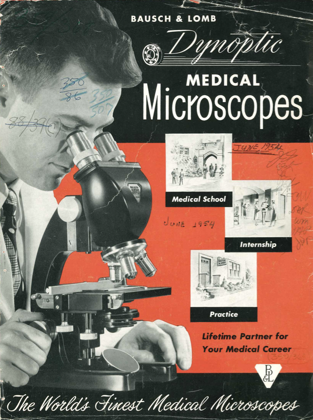 A person looking through a microscope
Description automatically generated