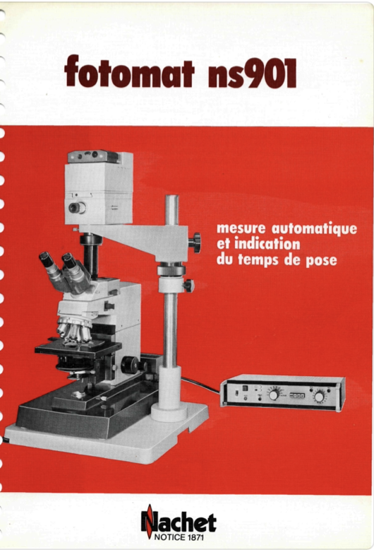 A white and black microscope
Description automatically generated