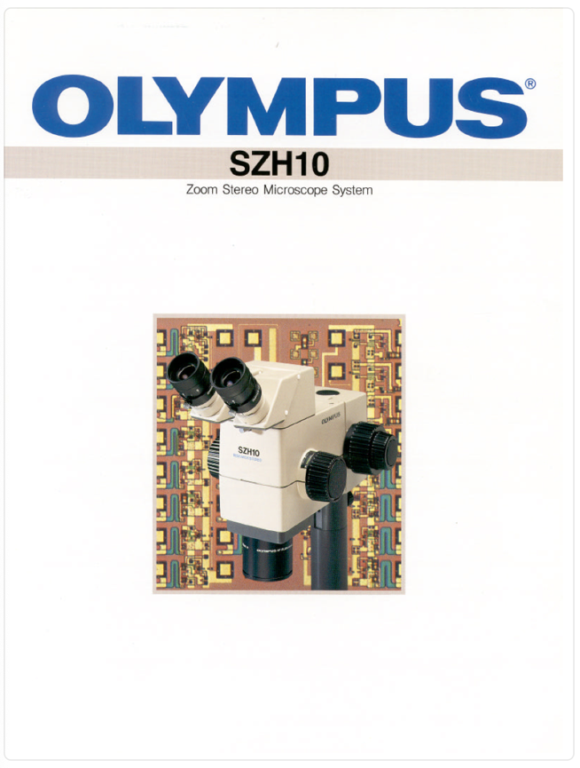 A white and black microscope
Description automatically generated