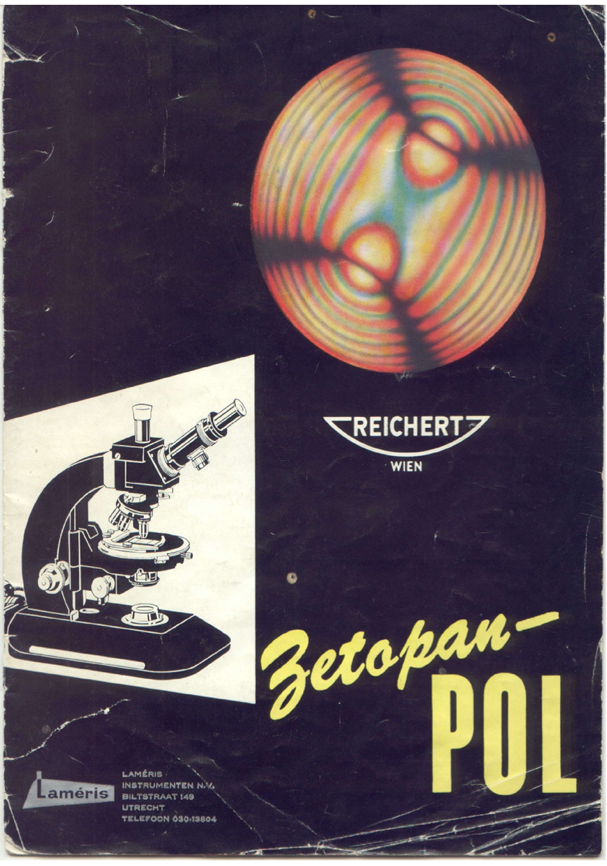 A black and white poster with a circular object and a red and yellow sphere
Description automatically generated