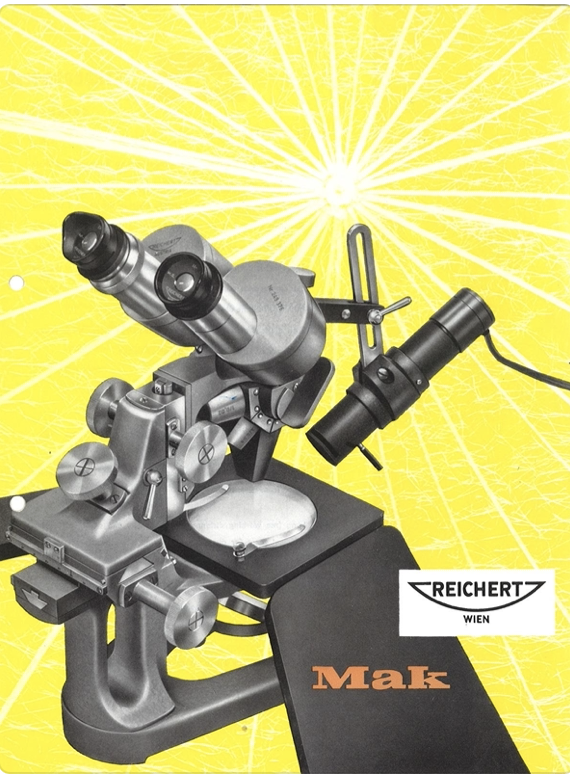 A microscope on a yellow background
Description automatically generated