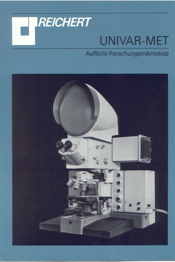 A white and black cover with a microscope
Description automatically generated