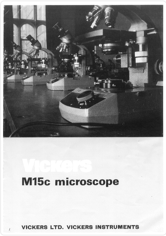 A close-up of a microscope
Description automatically generated