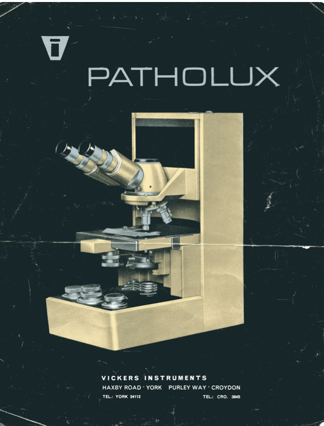 A close-up of a microscope
Description automatically generated