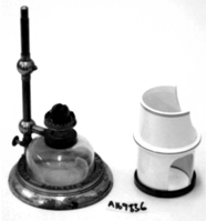 A picture containing cylinder, still life photography, indoor
Description automatically generated