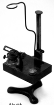 A picture containing metalware, lever, indoor, microscope
Description automatically generated