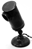 A picture containing cylinder, indoor, microphone
Description automatically generated