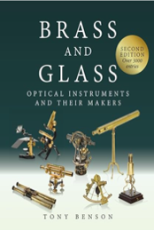 A book cover of brass and glass
Description automatically generated